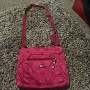 this is a coach purse it is pink on the outside and brownish on the inside